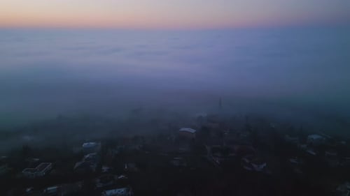 A Breathtaking Aerial View of a Sea of Clouds at Sunrise with Soft Pastel Hues Blending Into the