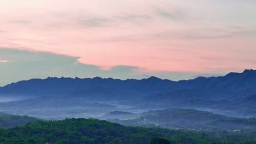 Aerial view of rolling hills landscape in slightly misty morning
