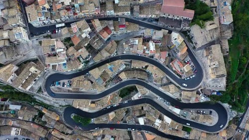 Aerial view of the old town of Ragusa Ibla and a winding road. View from above of the city in Ragusa