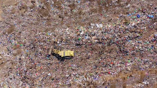 Landfill during collecting, sorting and pressing work