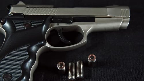 Handgun With Bullets On Table 3