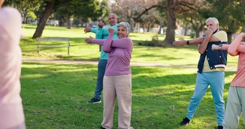 Personal trainer, senior and class with group for stretching, exercise or fitness on grass field