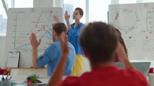 Business team applauding after presentation in modern office