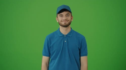 Green Screen Portrait of Handsome Delivery Person in Uniform