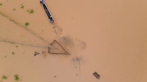 Aerial View of Fishing Boat on Muddy River