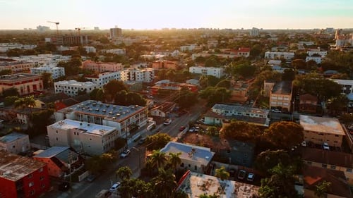 Residential area in Miami with multiple low-rise buildings and lots of trees.