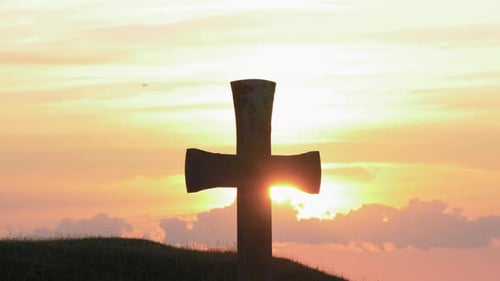 Stone Cross Silhouette at Golden Sunset