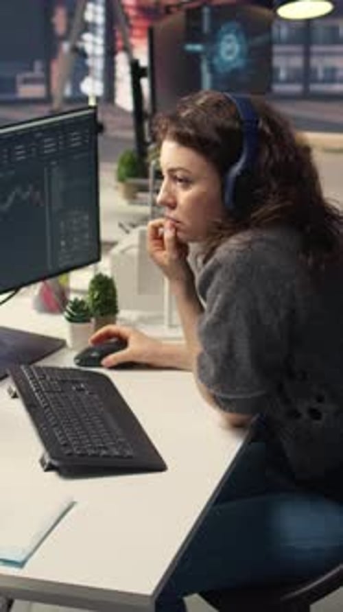 Vertical Video Financial Investor Works on PC Analyzing Stock Market Trends