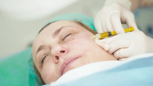 Woman Receives Facial Injection in Clinic Setting