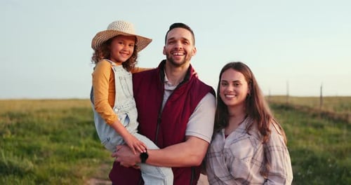 Happy Family Spending Time Together in Rural Field