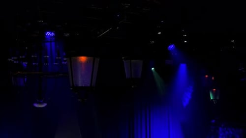 Blue stage lighting with lanterns and chandeliers