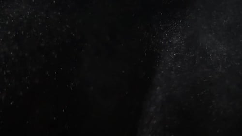 Water Droplets Spraying on Black Background