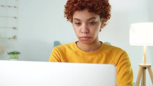 Sleepy Sad African American Woman Sitting at Table with Laptop Tired Overworked Girl Lazy to Work