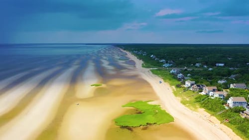 Dramatic Drone Shot of Beach at Low Tide with Storm Clouds Approaching