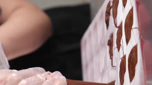 Filling Chocolate Mold with Melted Chocolate