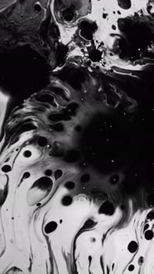Abstract Black Ink Spreading on White Background