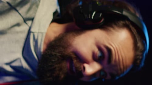 Close Up Gamer with Headset in the Dark