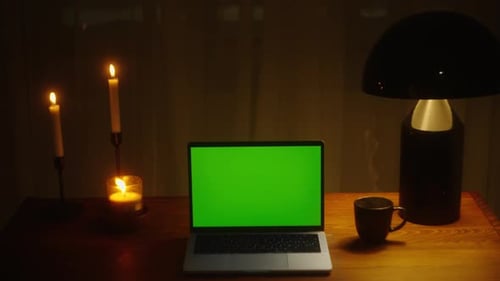 Laptop with Blank Green Screen Footage with Trees Swaying or Moving in the Wind Home Interior or