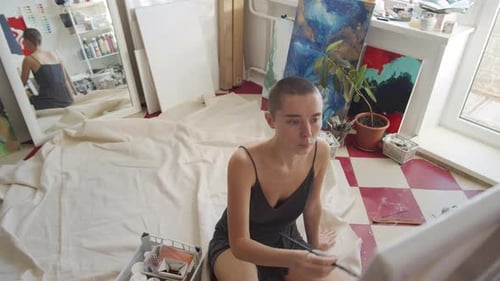 Painter Working In Studio