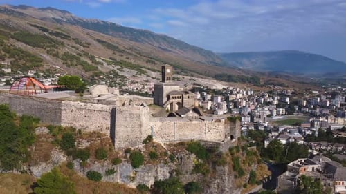 Aerial drone view of the old castle and fortress of the city of Gjirokaster or gjirokastra, Albania.
