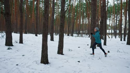 Runner Trains on Snowy Road