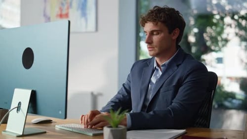 Serious Executive Typing Email at Computer Sitting Office Workplace Closeup