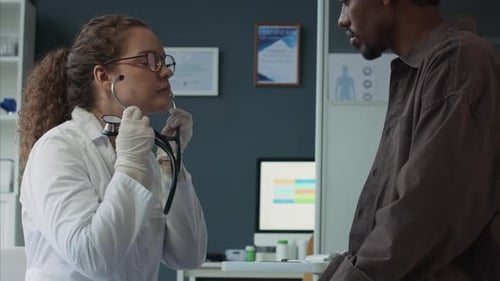 Doctor Preparing to Examine Patient with Stethoscope