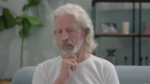 Portrait of Old Man Brainstorming while at Home