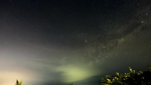 Night lapse of milky way in Bali Indonesia with light pollution