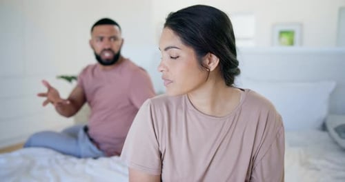 Woman, fight and conflict of couple in bedroom for mistake, breakup and jealousy at home