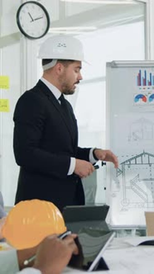 Portrait of Handsome Serious Purposeful Bearded Boss Which Talking and Discussing with Experienced