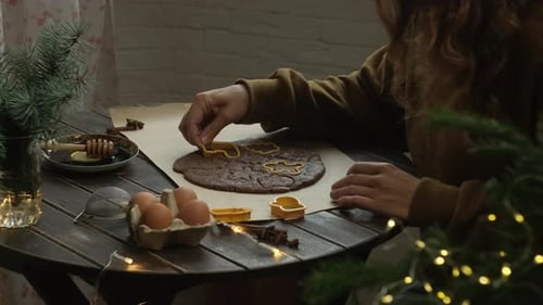 Woman Baking Holiday Cookies at Home