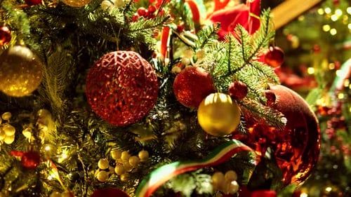 Big Beautiful Christmas New Year Tree Close Up with Toys Balls Decoration with Gifts in a White