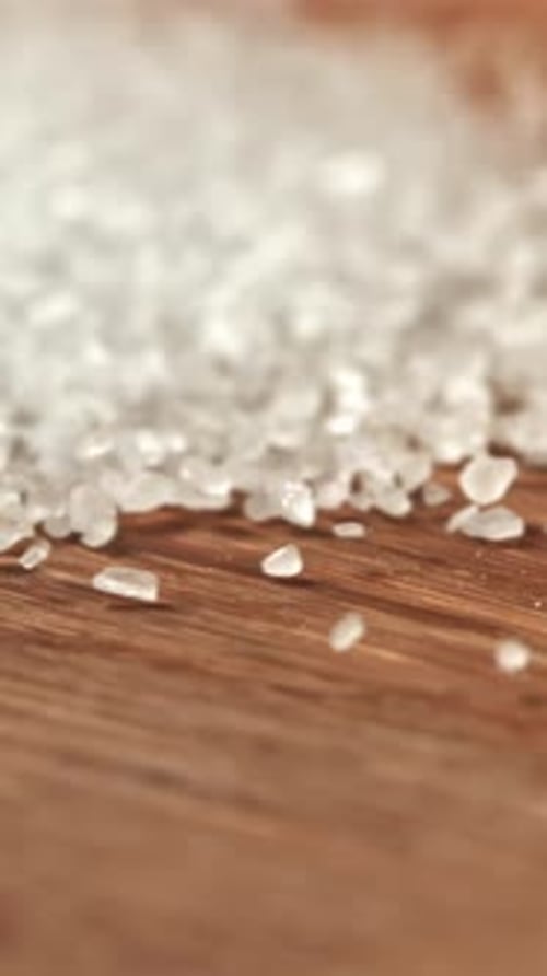 Salt Crystals on a Wooden Table Filmed on a Highspeed Camera at 1000 Fps