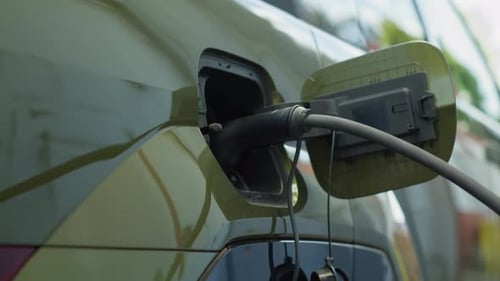 Close Up Shot of Electric Vehicle Charging at Modern Station
