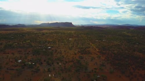 The Central Australian Outback. Cinematic dolly backwards shot moving forwards, over roads, local fl