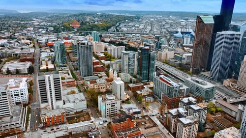 Beautiful cityscape of Seattle, Washington, US. Drone descending over the vast urban landscape