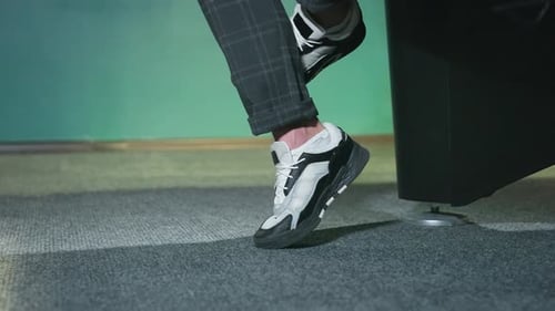 Fashionable Black and White Sneakers with Plaid Trousers