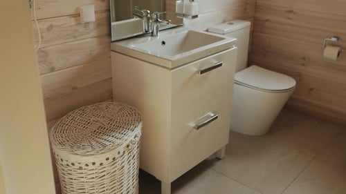 Clean Bathroom Interior with Wood Paneling