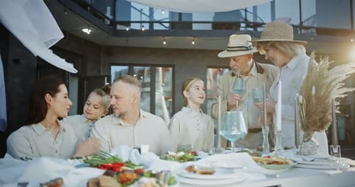 Family Celebrating a Happy Event in a Restaurant Happy People Have Fun Having Dinner in an Expensive