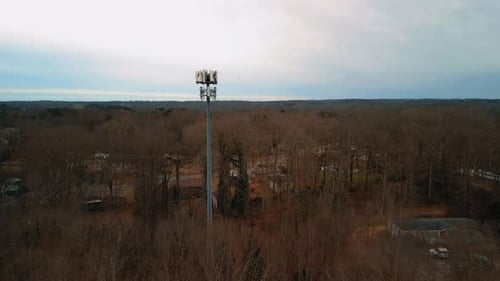Aerial Shot of Cell Phone Tower in Forest. 4k Drone Footage