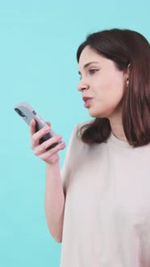 Woman sends voice message on modern smartphone