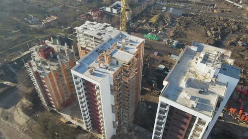 Aerial View of High Tower Crane and Residential Apartment Buildings Under Construction