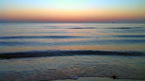 Watching the early morning sun rise across the Ocean