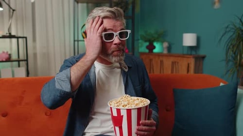 Man Wearing 3D Glasses Watching a Movie