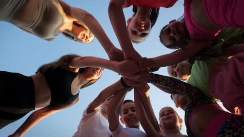 Young People Team Stacking Hands Low Angle Shot