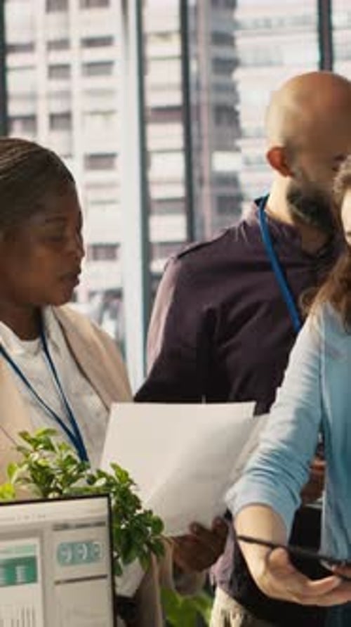 Vertical Video Coworkers in Office Doing Brainstorming Reviewing Financial Charts