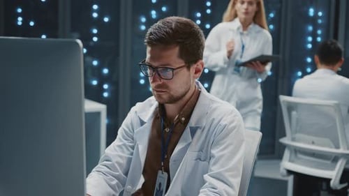 Man Coding Data in a Futuristic Server Room