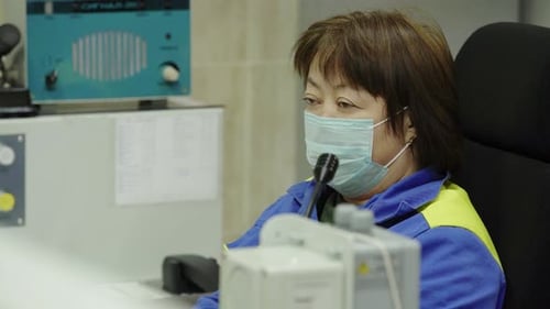 Woman Working with Scientific Equipment in a Lab