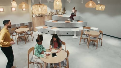 Coworkers Brainstorming Together in Modern Office Space